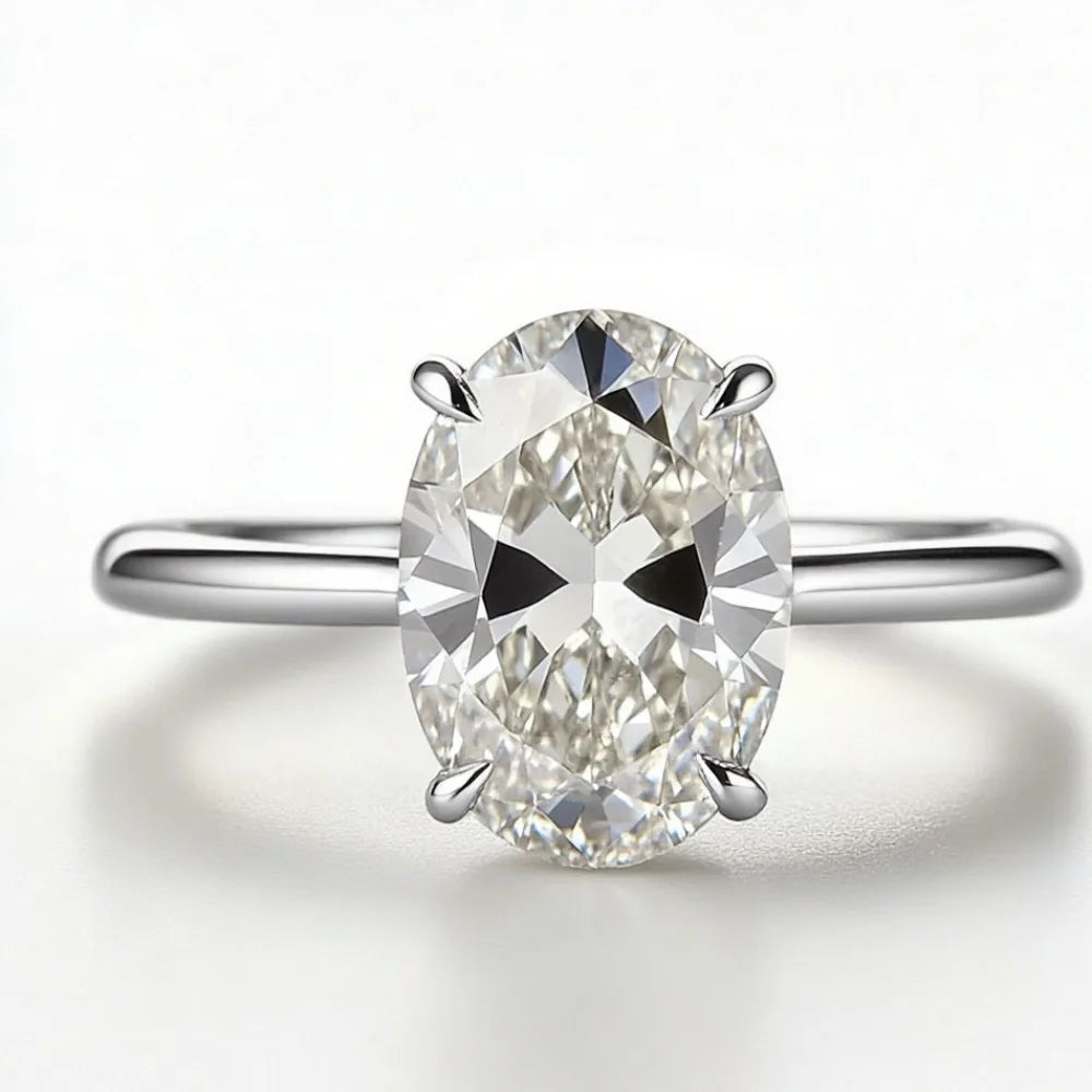 Elegant Oval Diamond Four-Claw Wedding Ring for Women 2026
